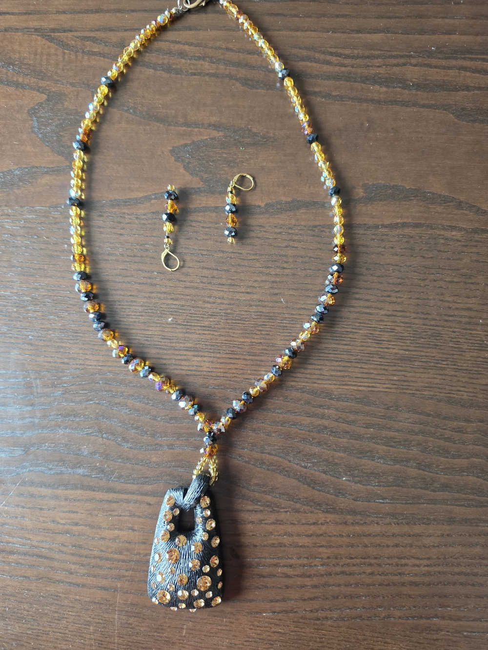 Amber and Black Beaded Necklace with Textured Pendant
